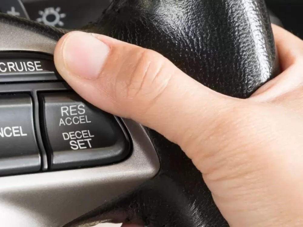 cruise control speeds up downhill
